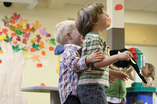 Kids hugging.